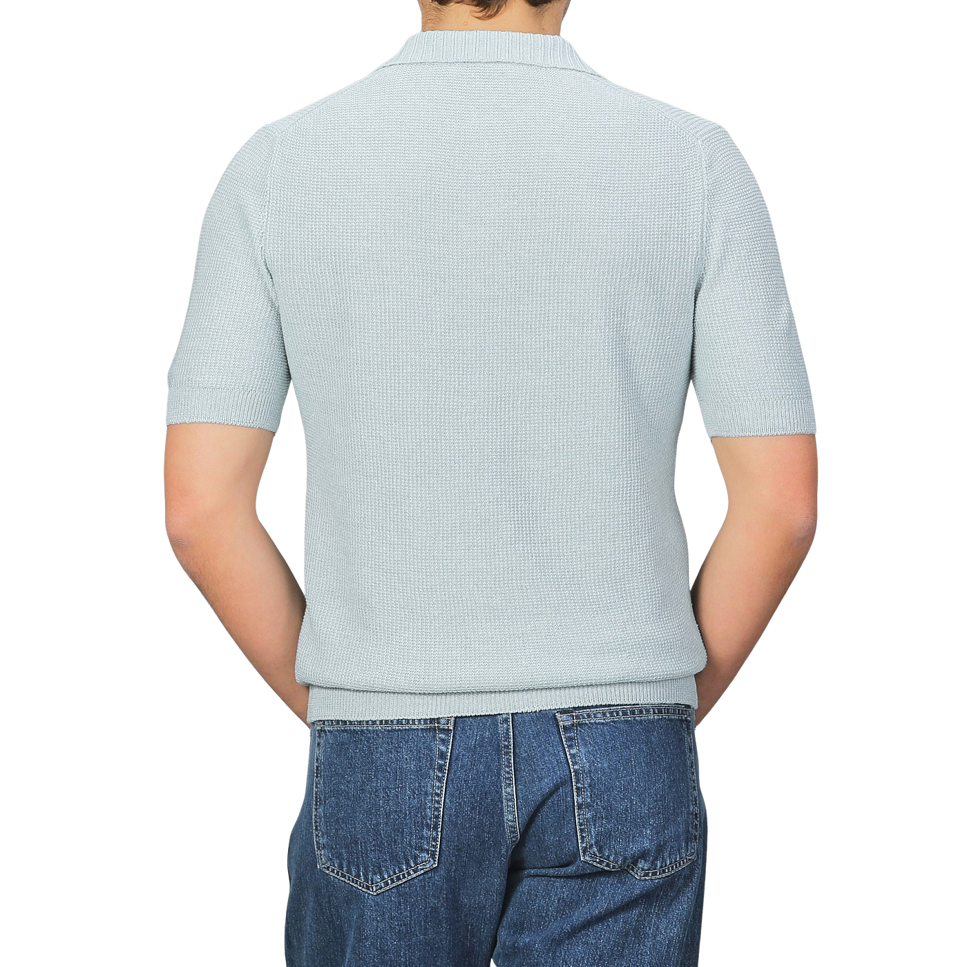 Back view of a person wearing a light gray short-sleeve textured polo shirt, Turquoise Cotton Linen by Gran Sasso, paired with blue jeans against a gray background.