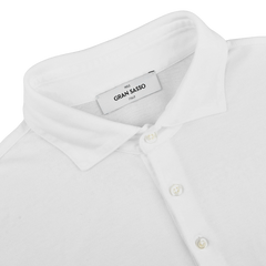 The White Washed Cotton Popover Shirt by Gran Sasso offers classic elegance with a modern twist. Made from cotton jersey, it features a comfortable slim fit and button closure.