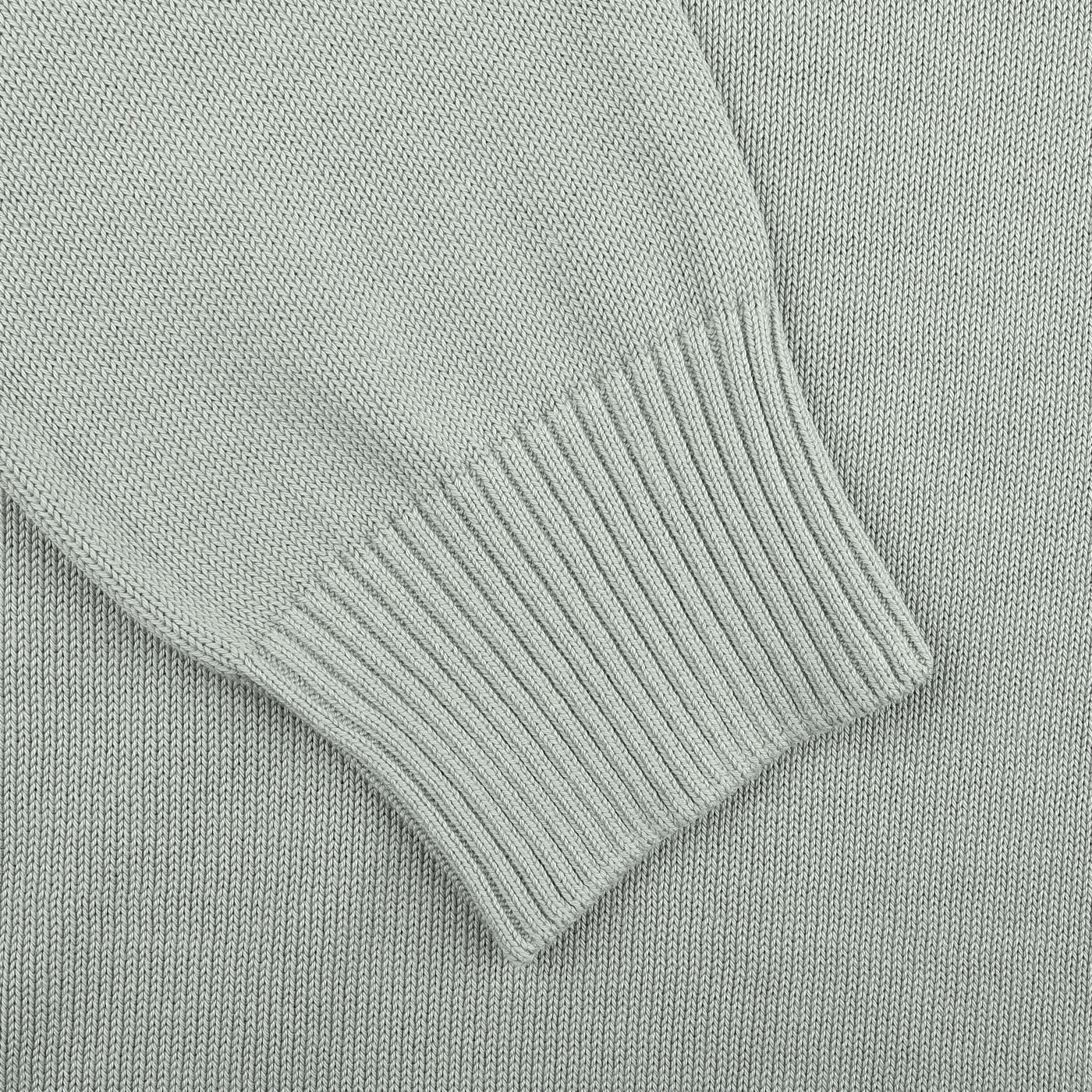 Close-up of a Sage Green Egyptian Cotton Crewneck Sweater by Gran Sasso, focusing on the sleeve with its ribbed cuff.