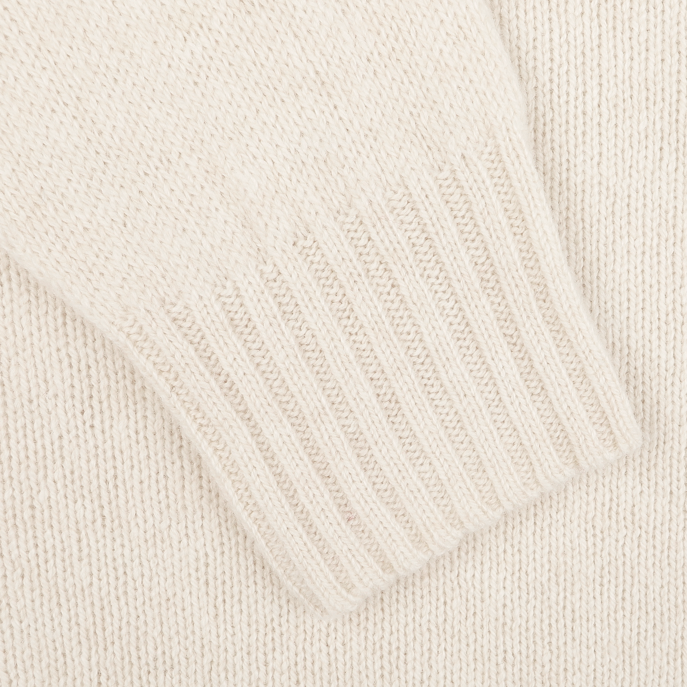 Close-up of the Almond White Extrafine Lambswool Crewneck from Harley of Scotland, highlighting the ribbed cuff details on the sleeve.