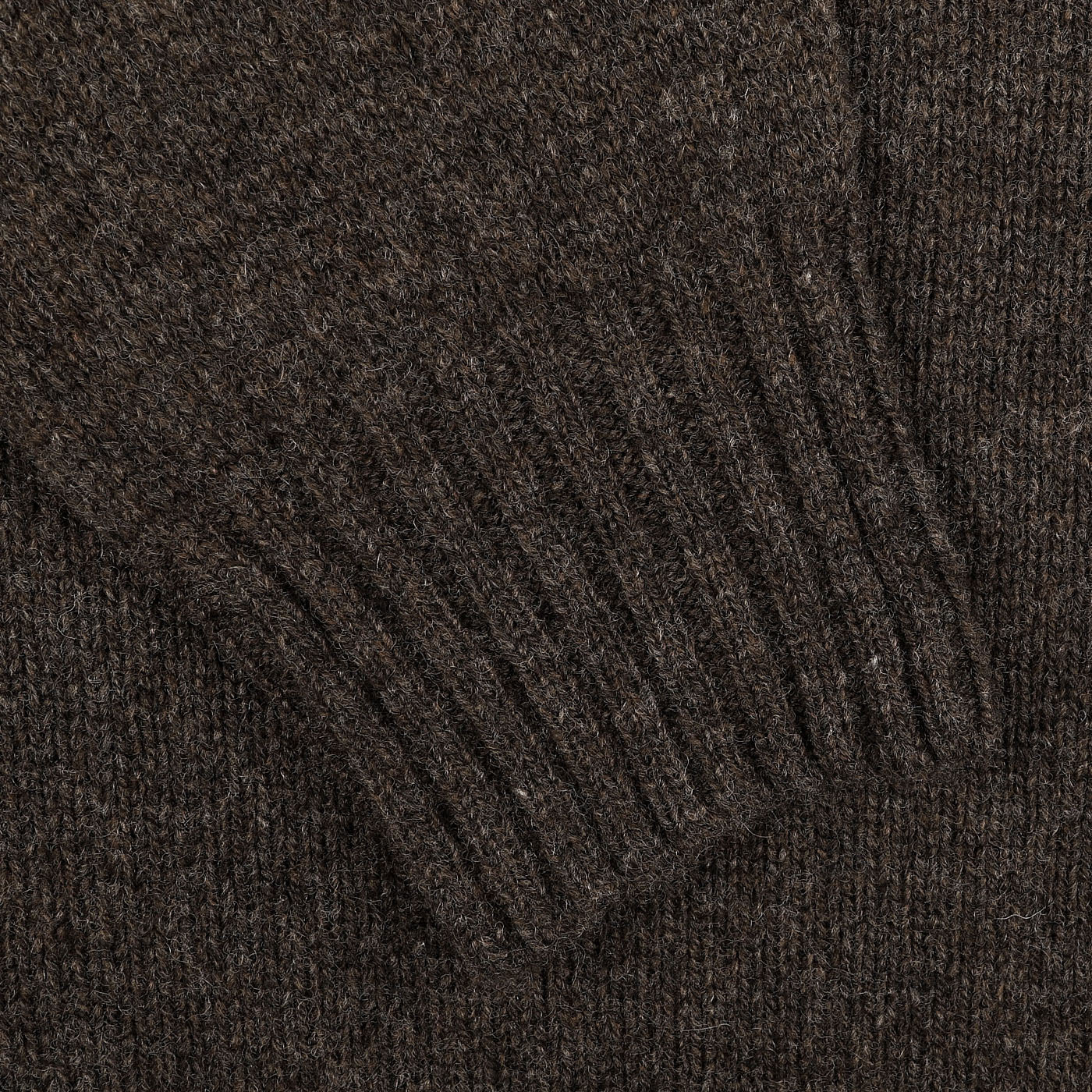 Close-up of a Porcupine Brown Extrafine Lambswool crewneck sweater featuring ribbed cuff detailing, crafted by Harley of Scotland.