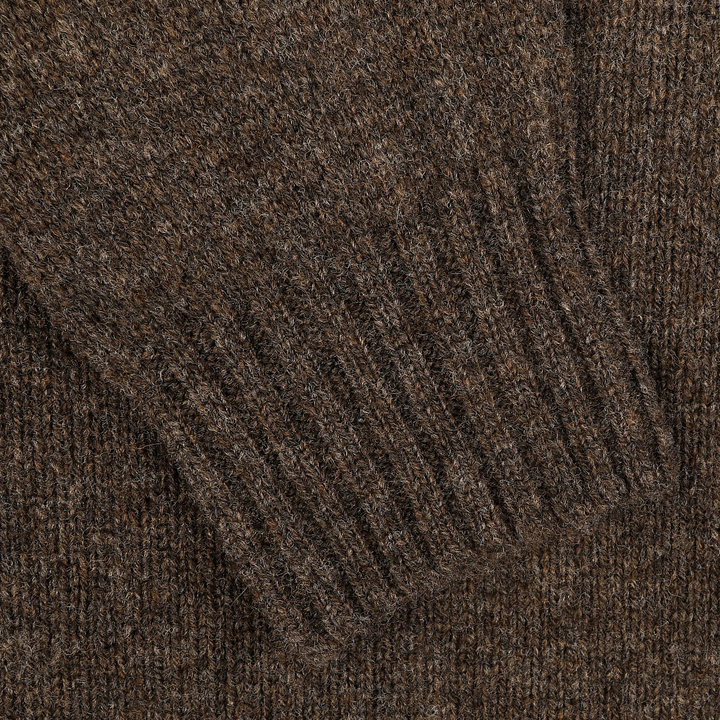 Close-up of the Porcupine Brown Extrafine Lambswool Rollneck, featuring a knitted sleeve with ribbed cuffs, crafted by Harley of Scotland.