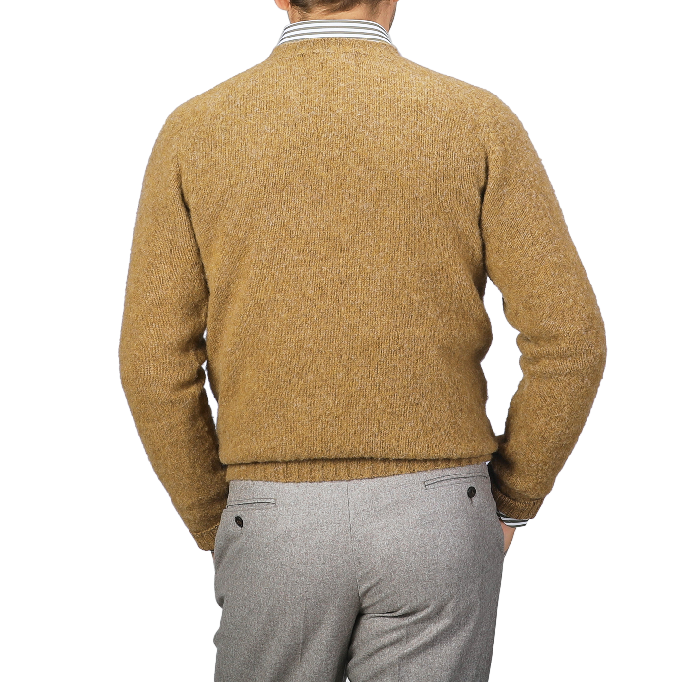 A person wearing an Asparagus Brushed Shaggy Wool Crewneck by Harley of Scotland and gray pants is shown from the back.