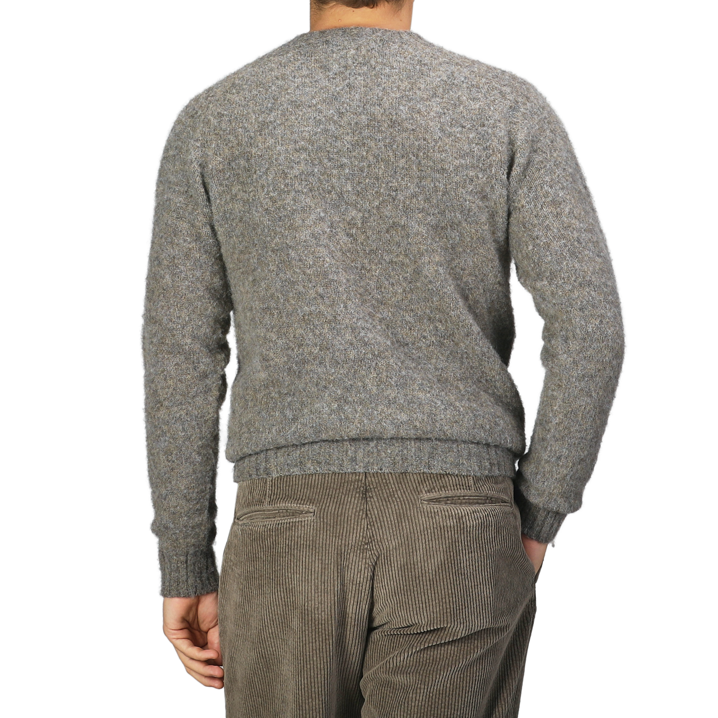 A person clad in a cozy Oyster Grey Brushed Shaggy Wool Crewneck sweater and brown corduroy pants, possibly from Harley of Scotland, is shown from the back against a plain background.