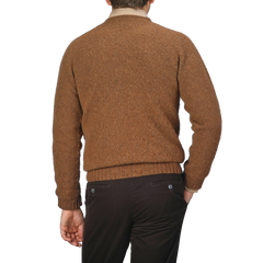 An individual wearing a Pecan Brown Brushed Shaggy Wool Crewneck by Harley of Scotland and dark pants is depicted from the back against a neutral background.