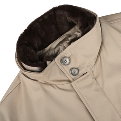 Close-up of a luxurious Herno Beige Loro Piana Wool Twill Jacket with a dark brown fur collar and two gray buttons near the neckline. The pure wool twill fabric has a fine texture, and the coat appears to be well-constructed.