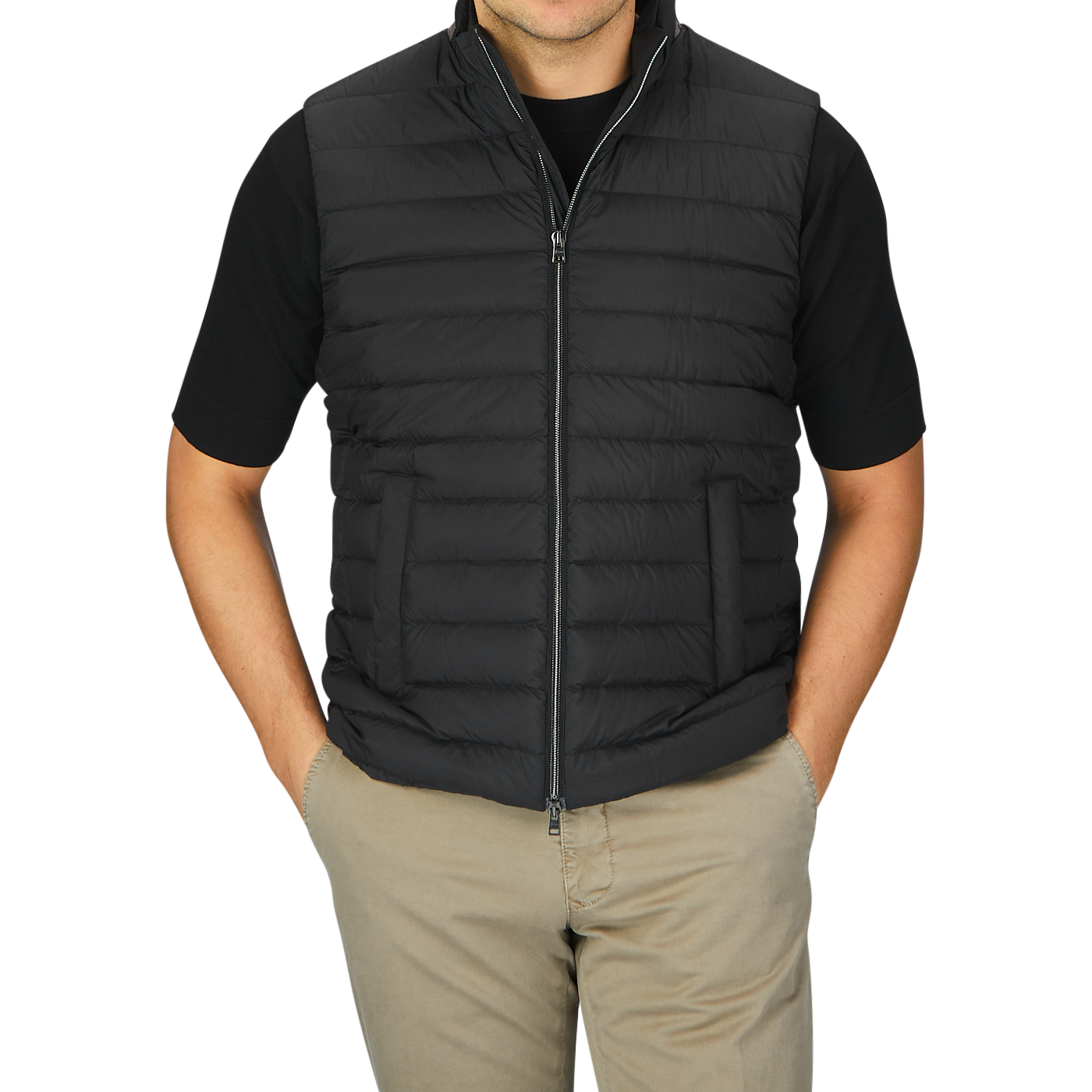A man wearing a black Nylon Goose Down Quilted Herno gilet.