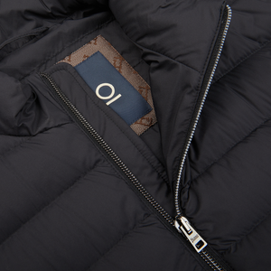 A close up of a Herno Black Nylon Goose Down Quilted Gilet with a label on it.