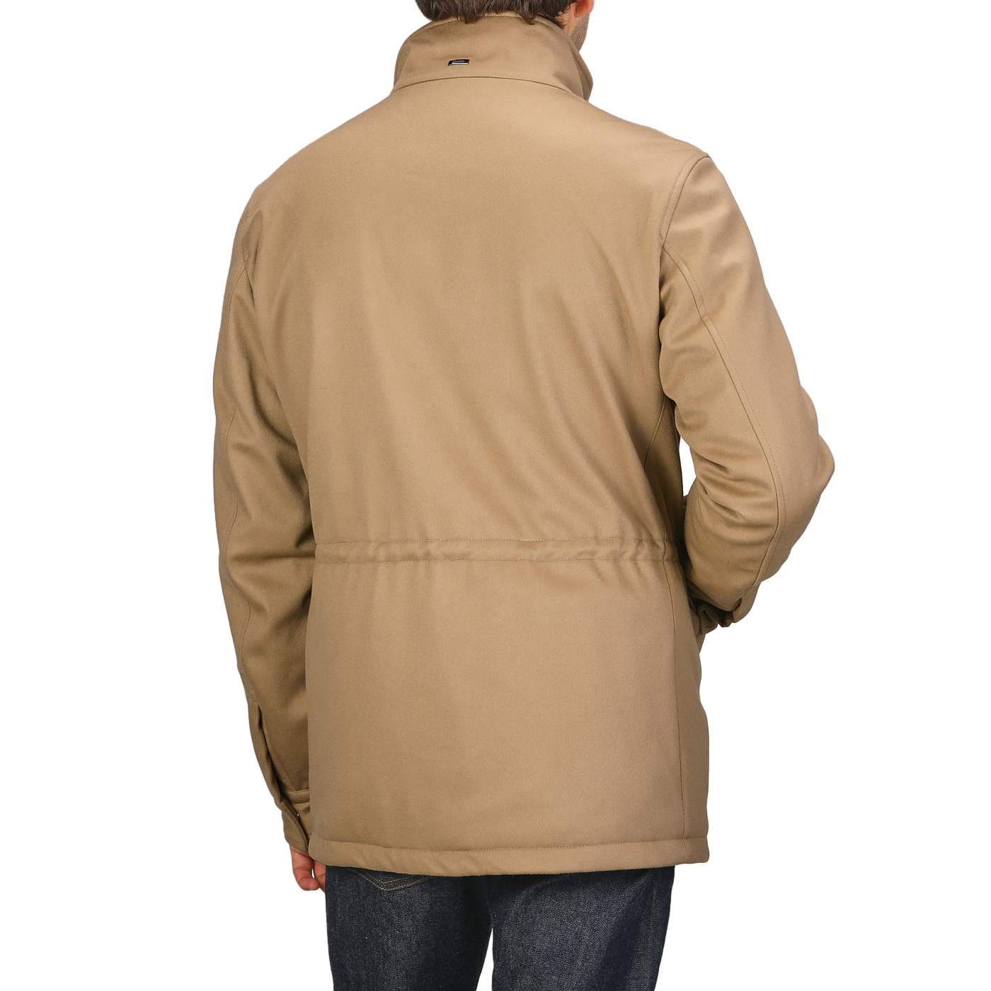 A person wearing a Camel Beige Loro Piana Wool Field Jacket by Herno and dark jeans is seen from the back, showcasing its technical down features crafted for any rain system.