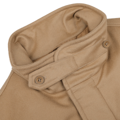 This close-up highlights the upper section of the Camel Beige Loro Piana Wool Field Jacket by Herno, featuring its high collar and buttoned strap detail.