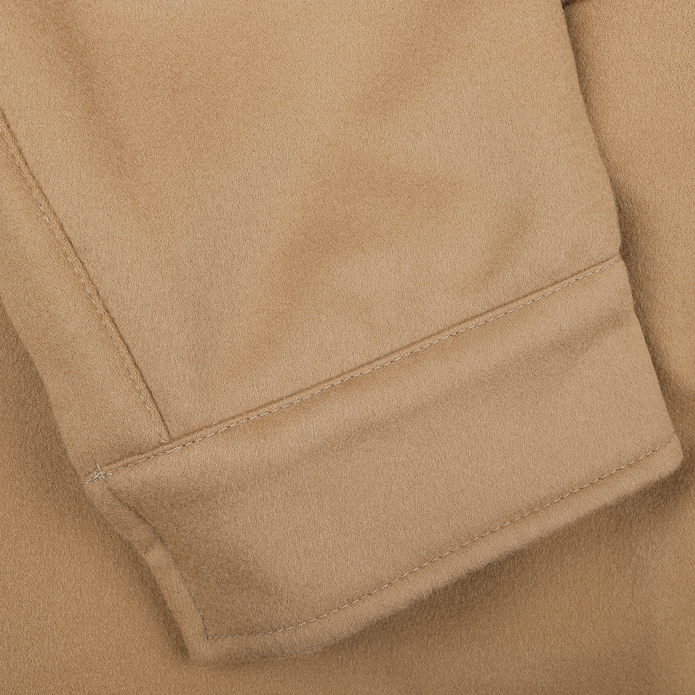 Close-up of the sleeve on the Herno Camel Beige Loro Piana Wool Field Jacket, highlighting the precision of its folded cuff with visible stitching.