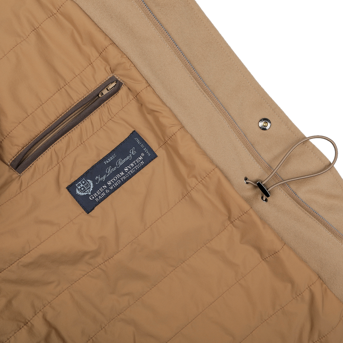 Close-up of the interior of a camel beige Herno jacket with quilted lining, showcasing a zippered pocket, drawstring, and Loro Piana Wool label. The field jacket is equipped with Rain System technology for enhanced weather protection.