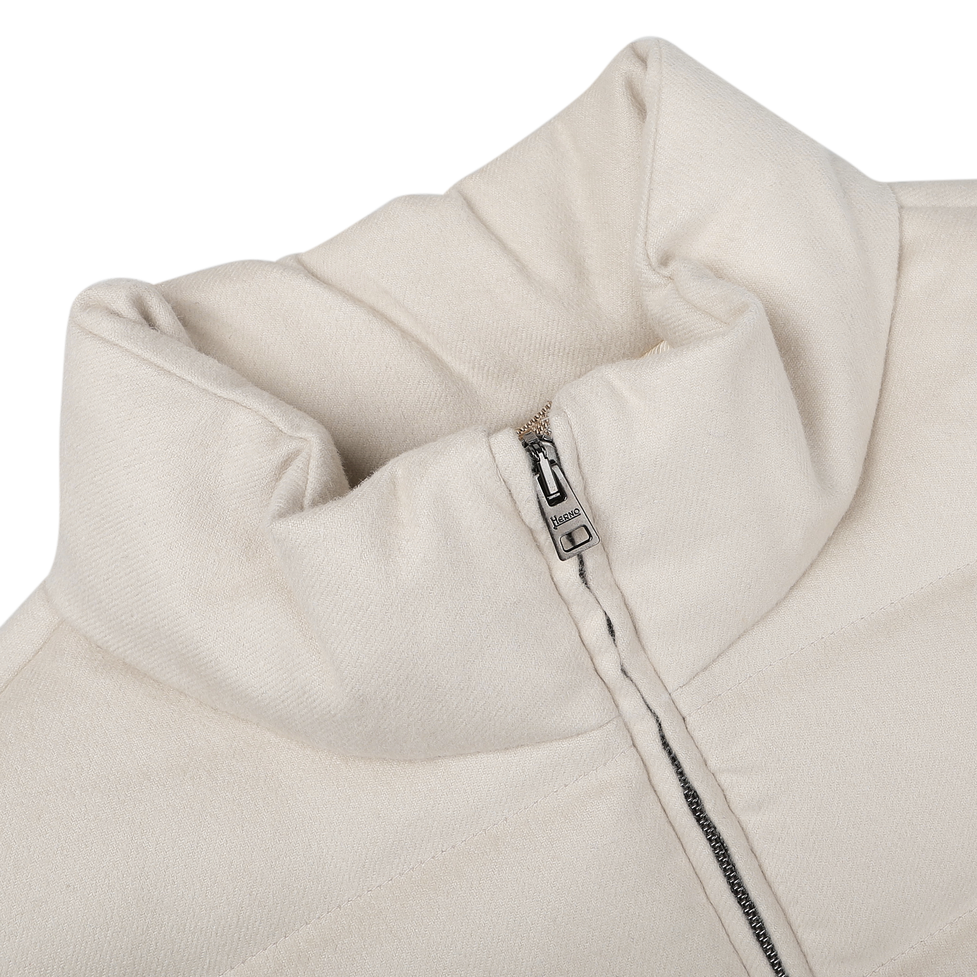 Close-up of a Cream Beige Cashmere Silk Bomber Jacket by Herno, featuring a high collar and partially unzipped zipper, crafted from luxurious silk and cashmere for added elegance.