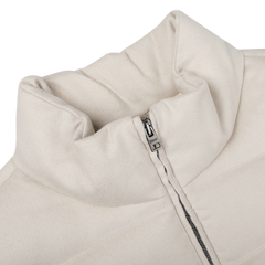 Close-up of a Cream Beige Cashmere Silk Bomber Jacket by Herno, featuring a high collar and partially unzipped zipper, crafted from luxurious silk and cashmere for added elegance.