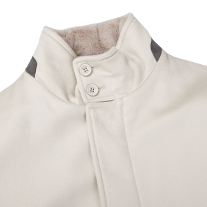 A Cream Beige Water Repellent Cashmere Herno car coat with black buttons.
