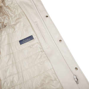 The back of a Cream Beige Water Repellent Cashmere Car Coat by Herno with a zipper.