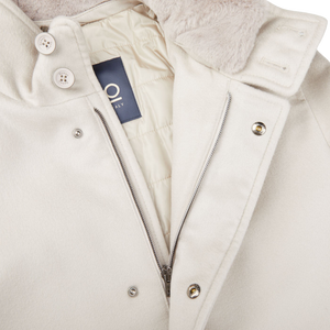 A close up of a Herno Cream Beige Water Repellent Cashmere Car Coat with a fur collar.