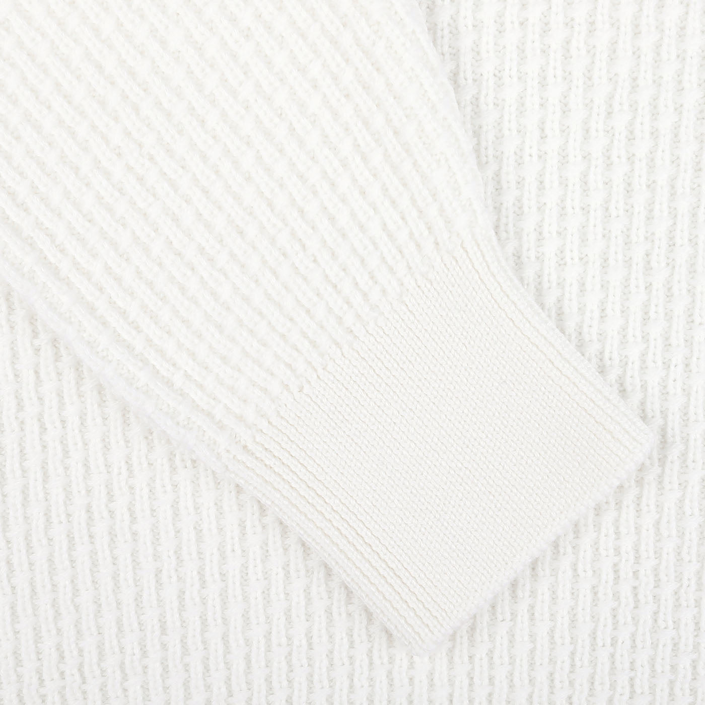 Detailed close-up of the sleeve of the Herno Cream White Virgin Wool Knitted Pullover, showcasing its ribbed texture and intricate stitching.