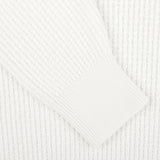 Detailed close-up of the sleeve of the Herno Cream White Virgin Wool Knitted Pullover, showcasing its ribbed texture and intricate stitching.