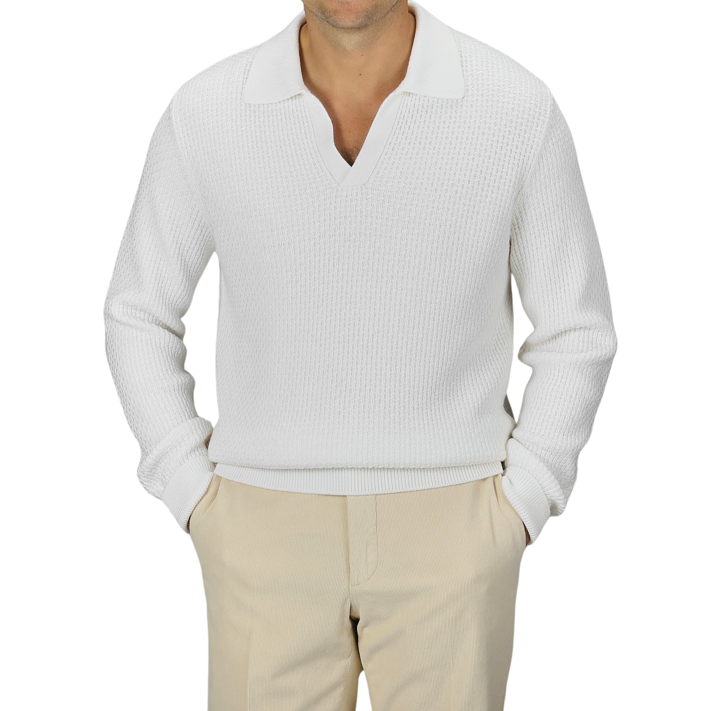 A man is wearing a Cream White Virgin Wool Knitted Pullover from Herno, paired with beige pants. The background is plain gray.