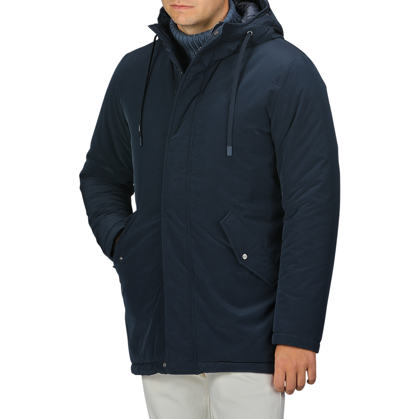 A person in a Herno Dark Blue Nylon Technical Padded Jacket and light-colored pants stands with their right hand in their pocket.