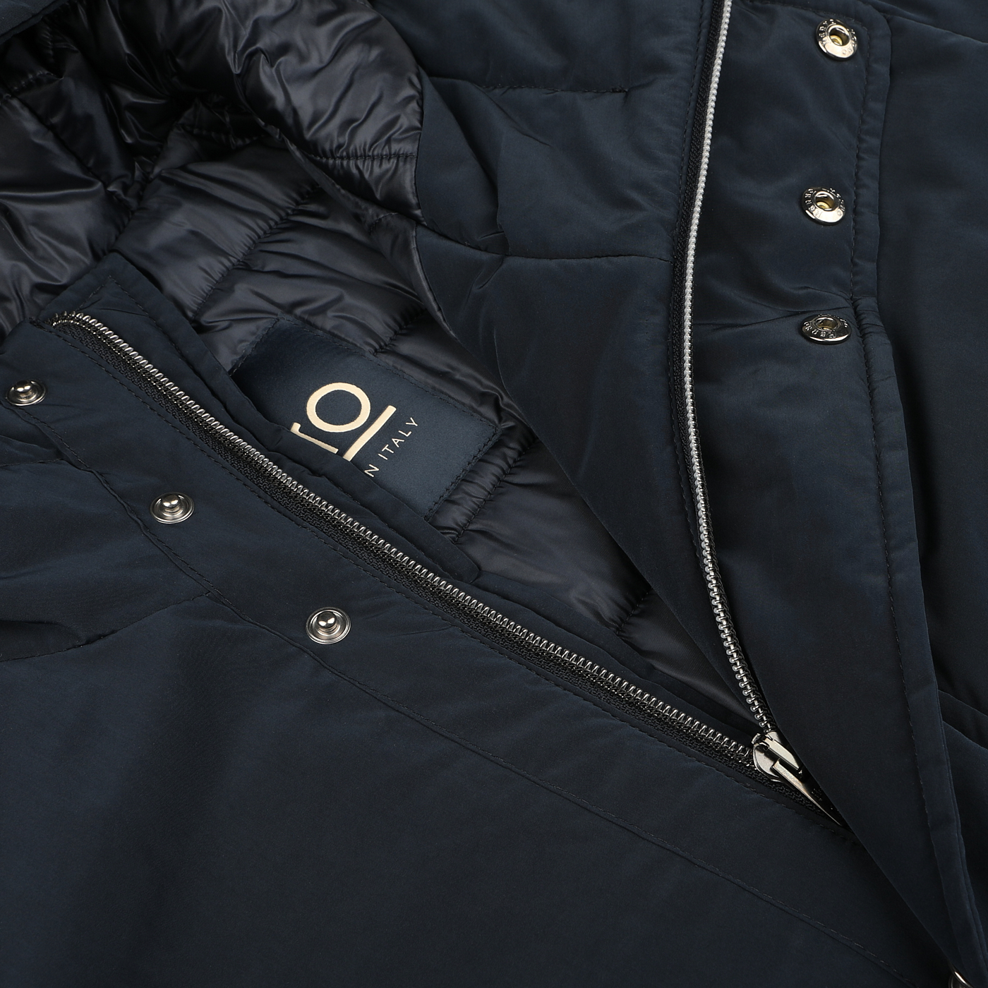 Close-up of a Herno Dark Blue Nylon Technical Padded Jacket with a partially unzipped front, revealing the interior and a label indicating "Made in Italy.