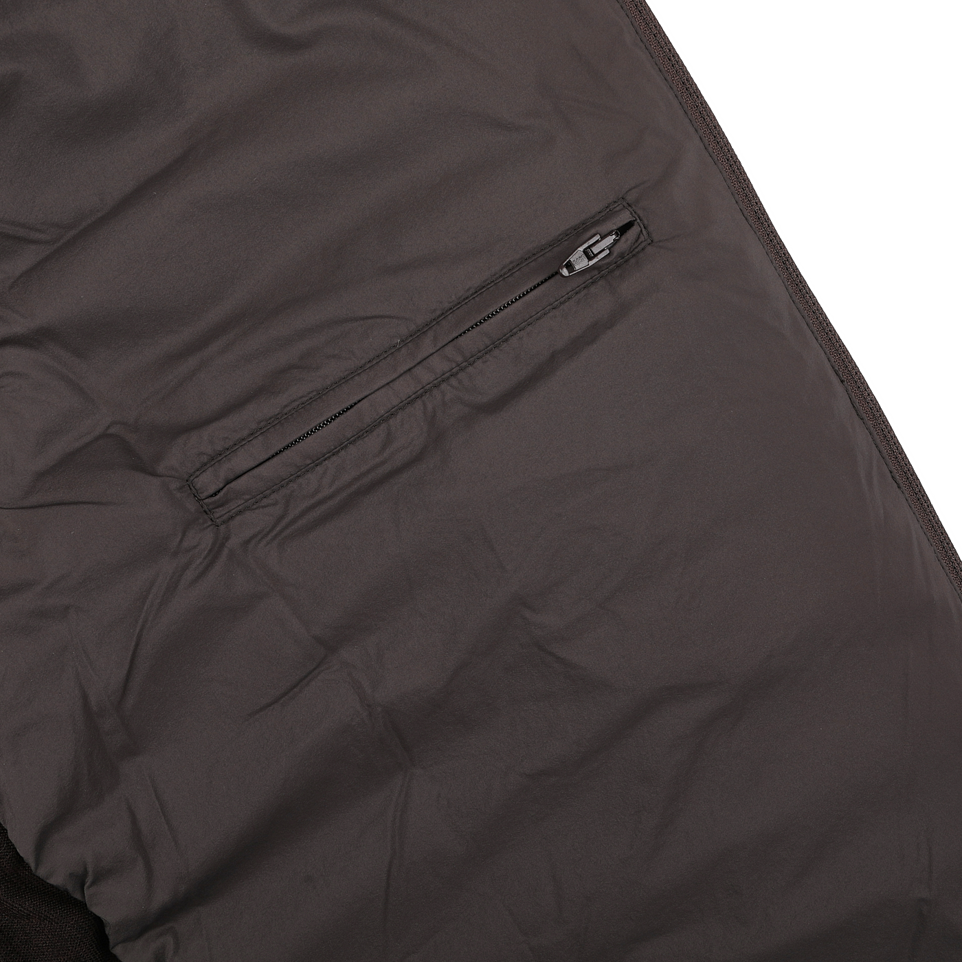 Close-up of Herno's Dark Brown Wool Silk Nylon Padded Jacket's inner pocket, highlighting the visible zipper, intricate stitching, and rich fabric texture.