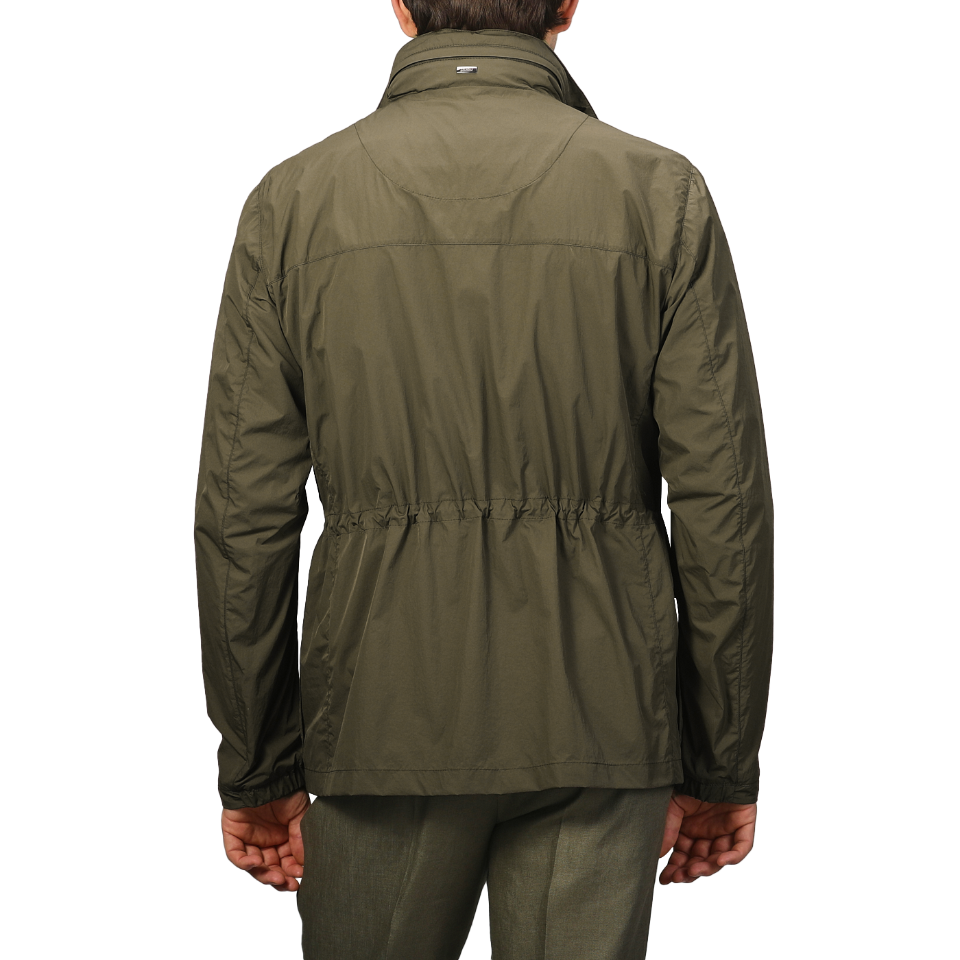 Seen from the back, a person wears Herno's Dark Green Ultralight Nylon Field Jacket with wind and rain resistance, featuring an elastic waistband.