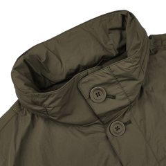 The Herno Dark Green Ultralight Nylon Field Jacket, with a high collar and two visible buttons, offers superior wind and rain resistance.