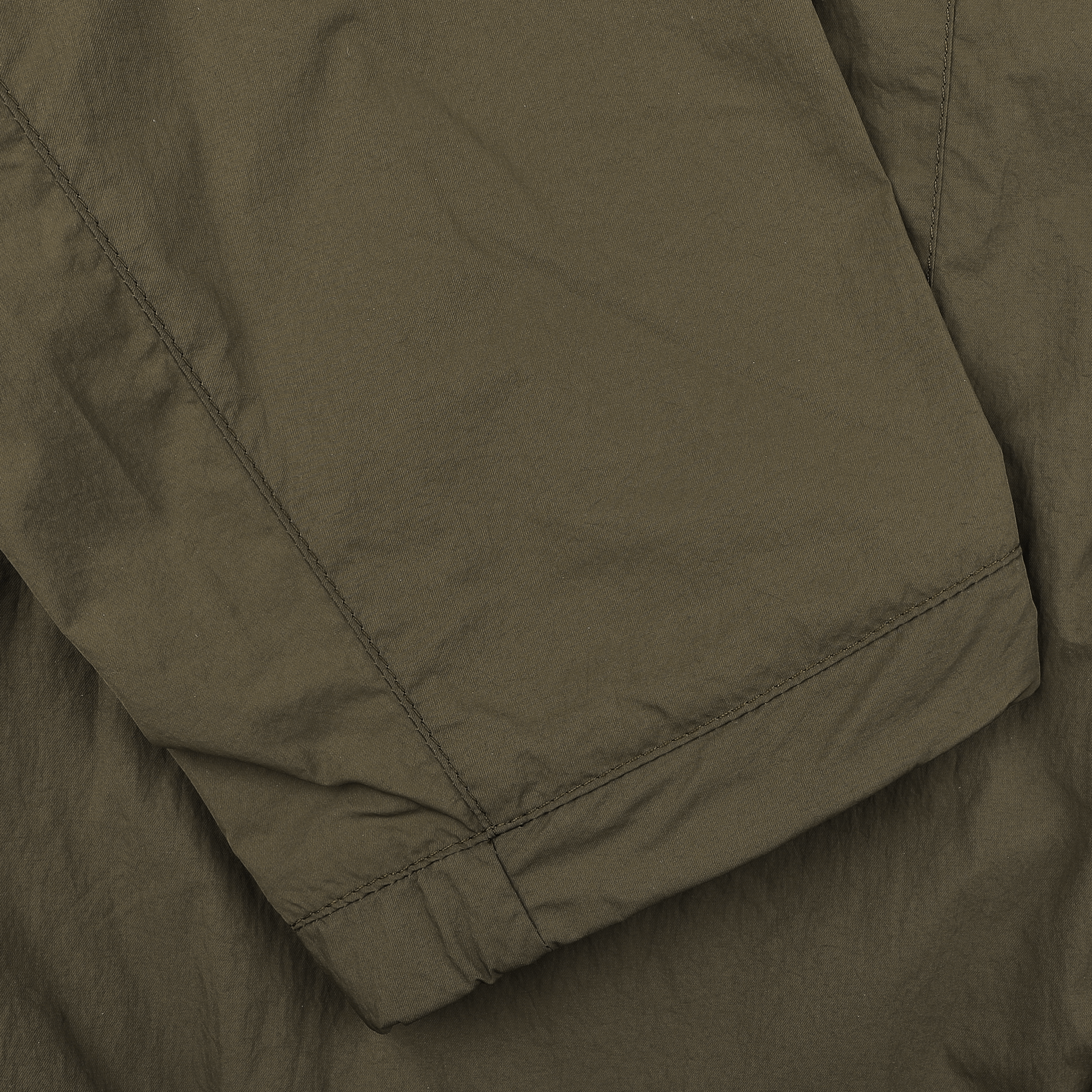 Close-up of the Herno Dark Green Ultralight Nylon Field Jacket, featuring visible stitching and seams for wind and rain resistance.