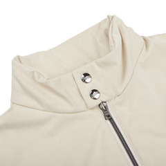 Close-up of a Herno Light Beige Suede Alcantara Zip Gilet with a high collar, crafted in luxurious Alcantara fabric, featuring a front zipper and two metallic snap buttons at the top.