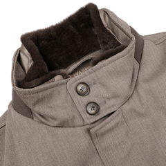 Close-up of the Light Brown Loro Piana Wool Twill Jacket by Herno, highlighting its high collar with two buttons and dark brown fur lining, crafted from pure wool.