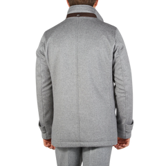 A man sporting a Herno Light Grey Water Repellent Cashmere Car Coat exudes luxury.