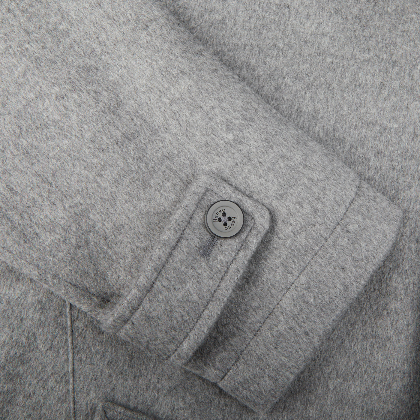 A close up image of a luxurious Herno Light Grey Water Repellent Cashmere Car Coat.