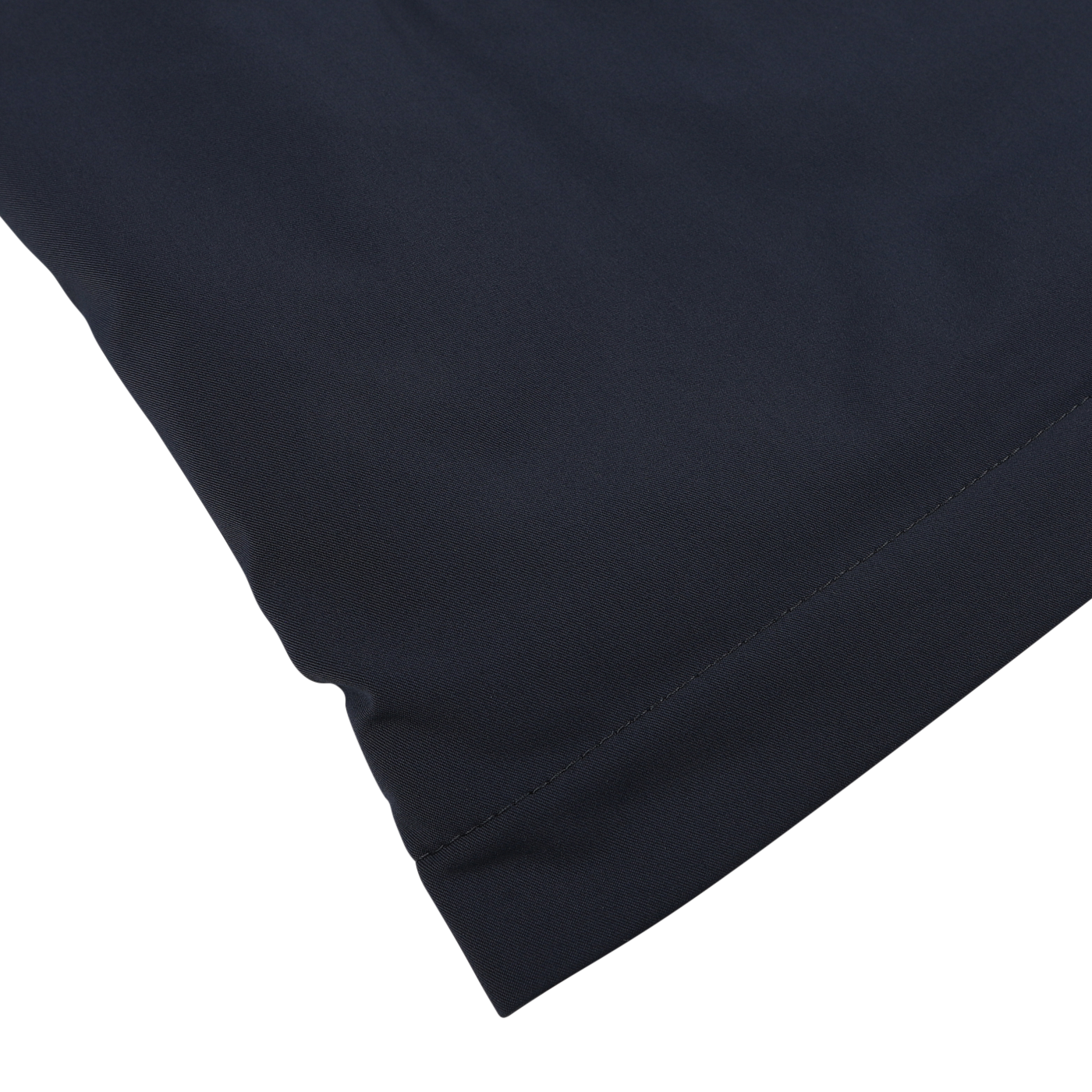 Close-up of the corner of a Herno Navy Blue Faux Fur Lined Nylon Car Coat, highlighting the double seam near the edge against a light background.