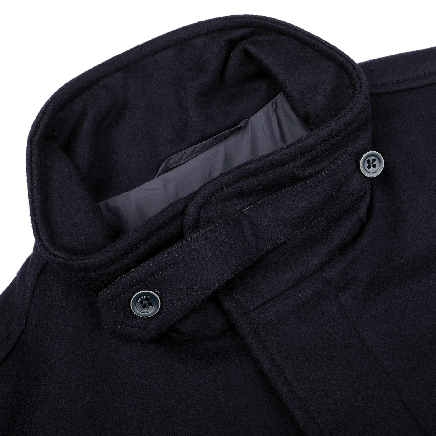 Close-up of the Herno Navy Blue Loro Piana Wool Field Jacket, designed to be rain-resistant and crafted from pure wool, featuring a high collar with two black buttons on the collar strap.