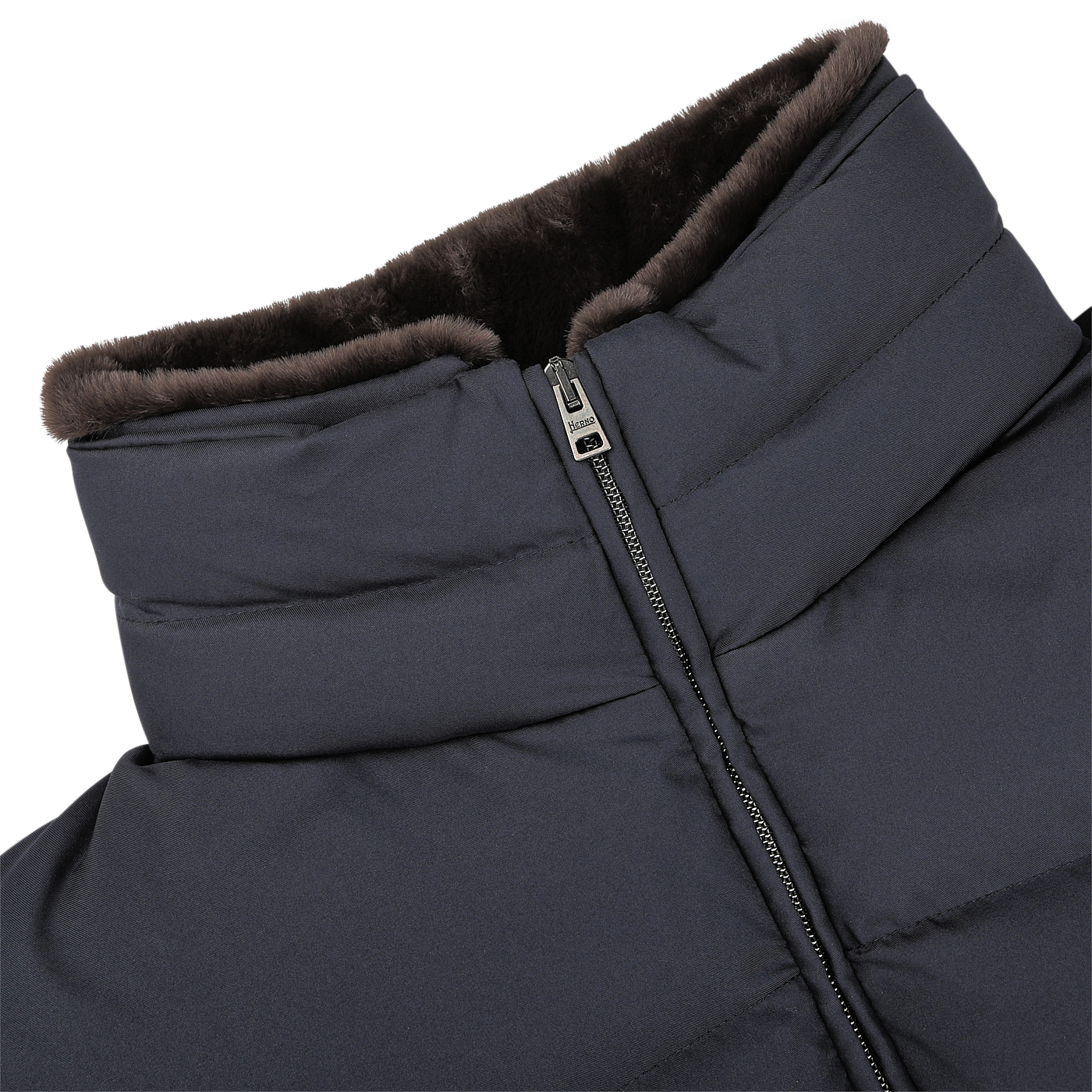 Close-up of a navy blue, zip-up goose down quilted gilet from Herno, featuring a high collar and lined on the inside with brown faux fur for added warmth.