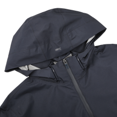 The Herno Navy Blue Nylon Gore-Tex Blouson features a hood, zipper, small chest logo, and waterproof Gore-Tex finish.