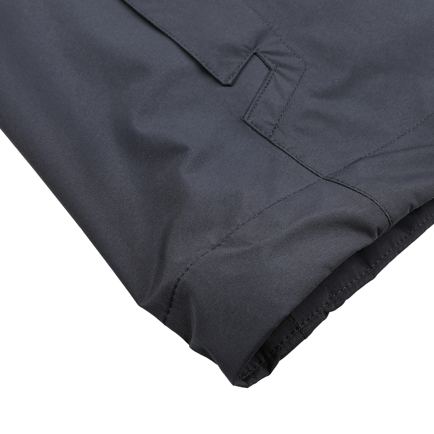 Close-up of a neatly folded corner of a Herno Navy Blue Nylon Gore-Tex Blouson, showcasing stitching details and a flap pocket on a flat surface.