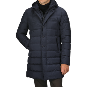 A person wearing a Herno Navy Blue Nylon Gore-Tex Laminar Coat, standing against a plain background.