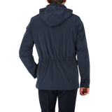 The back view of a man wearing a Herno Navy Blue Nylon Hood Field Jacket.