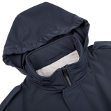 The Herno navy blue nylon hood field jacket features a zipper on its hood, making it a stylish and water-resistant option.