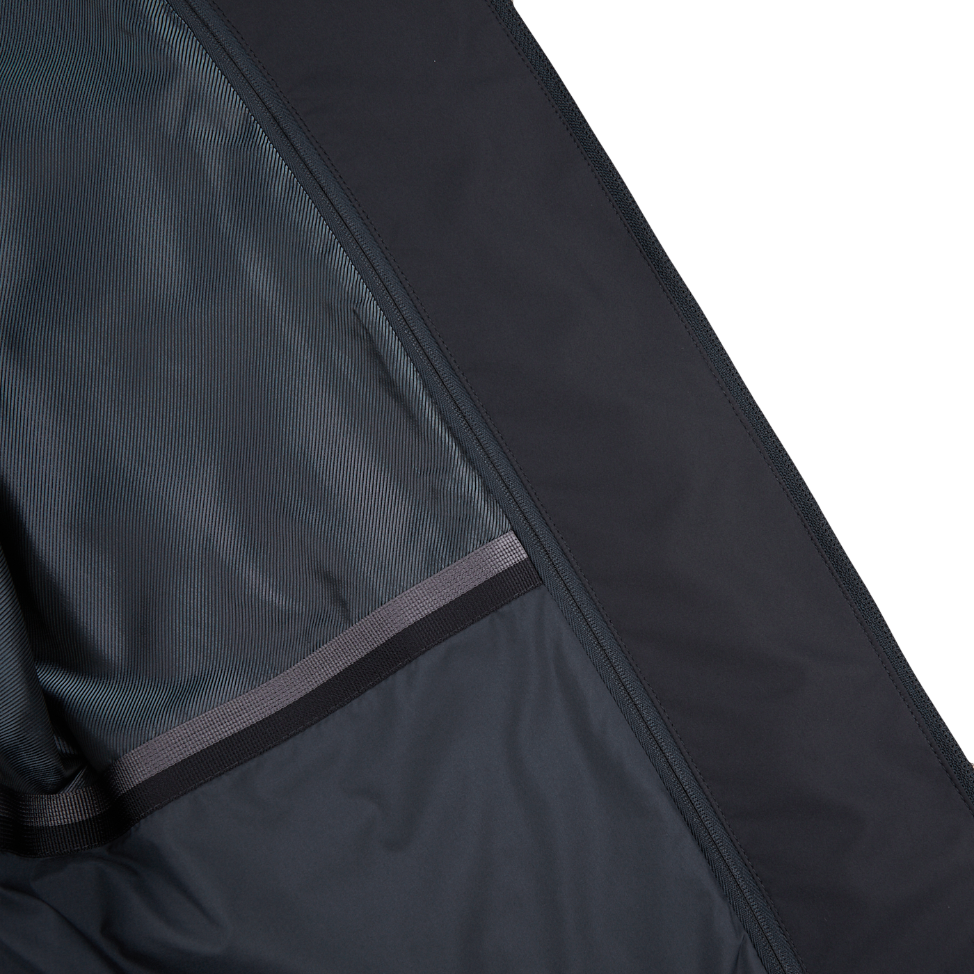 The inside of a Herno navy blue nylon hybrid blazer with a zippered pocket.