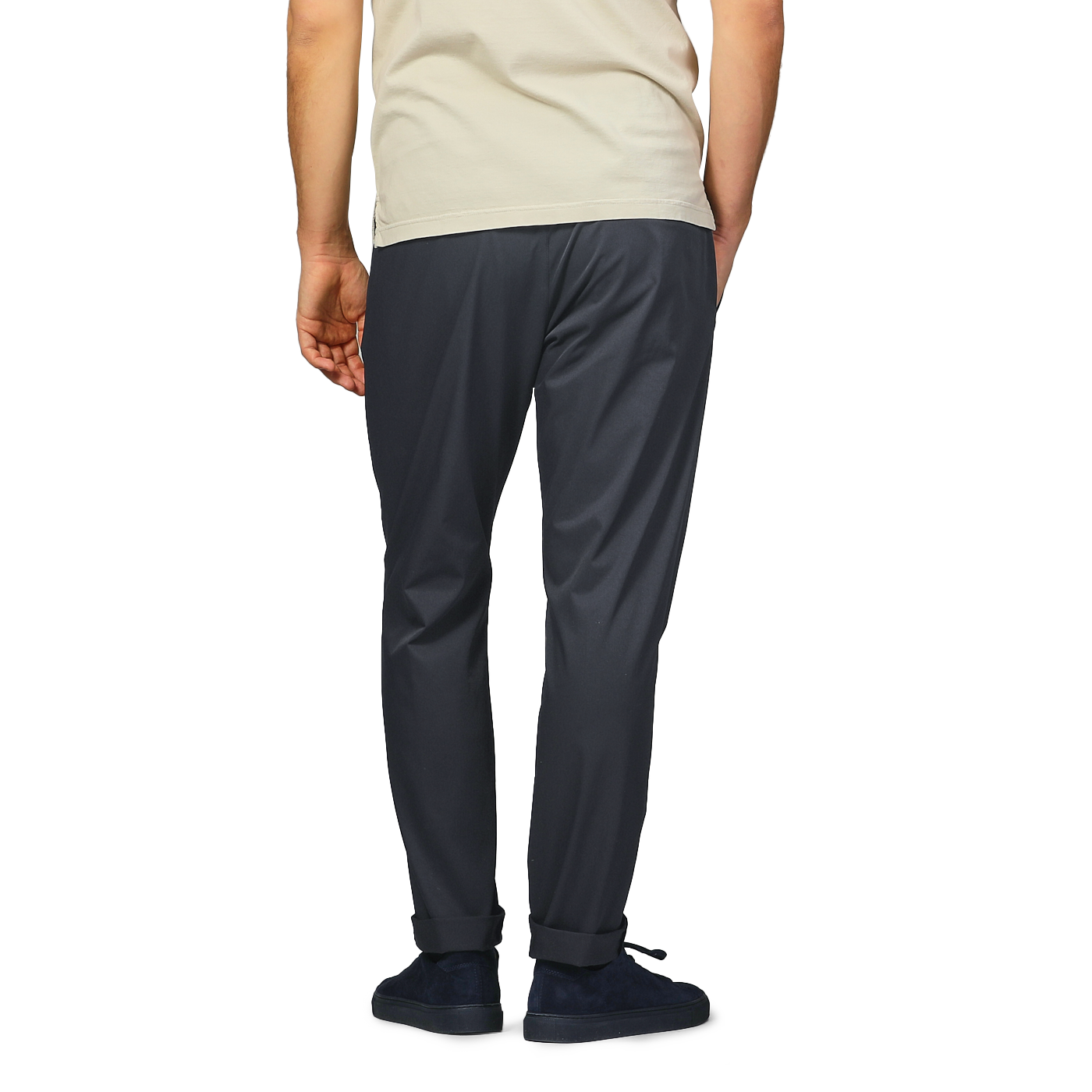 Back view of a person in a beige shirt and Herno's navy blue nylon stretch drawstring trousers, with hands in pockets.