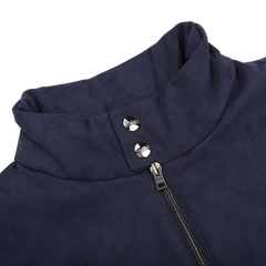 Close-up of a Herno Navy Blue Suede Alcantara Zip Gilet collar featuring two silver snap buttons and a zipper. The fabric, resembling Alcantara, appears soft with a smooth texture visible.