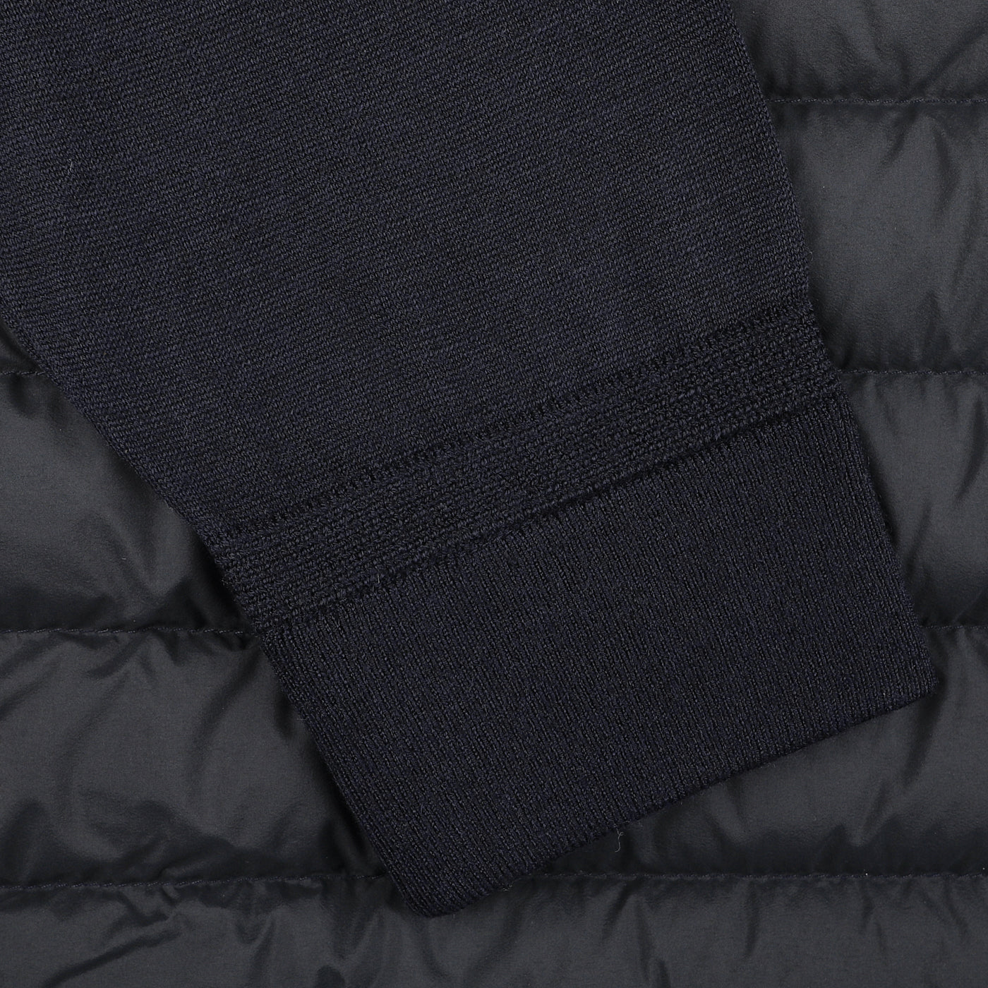 Close-up of a sleeve on the Herno Navy Blue Wool Silk Nylon Padded Jacket.