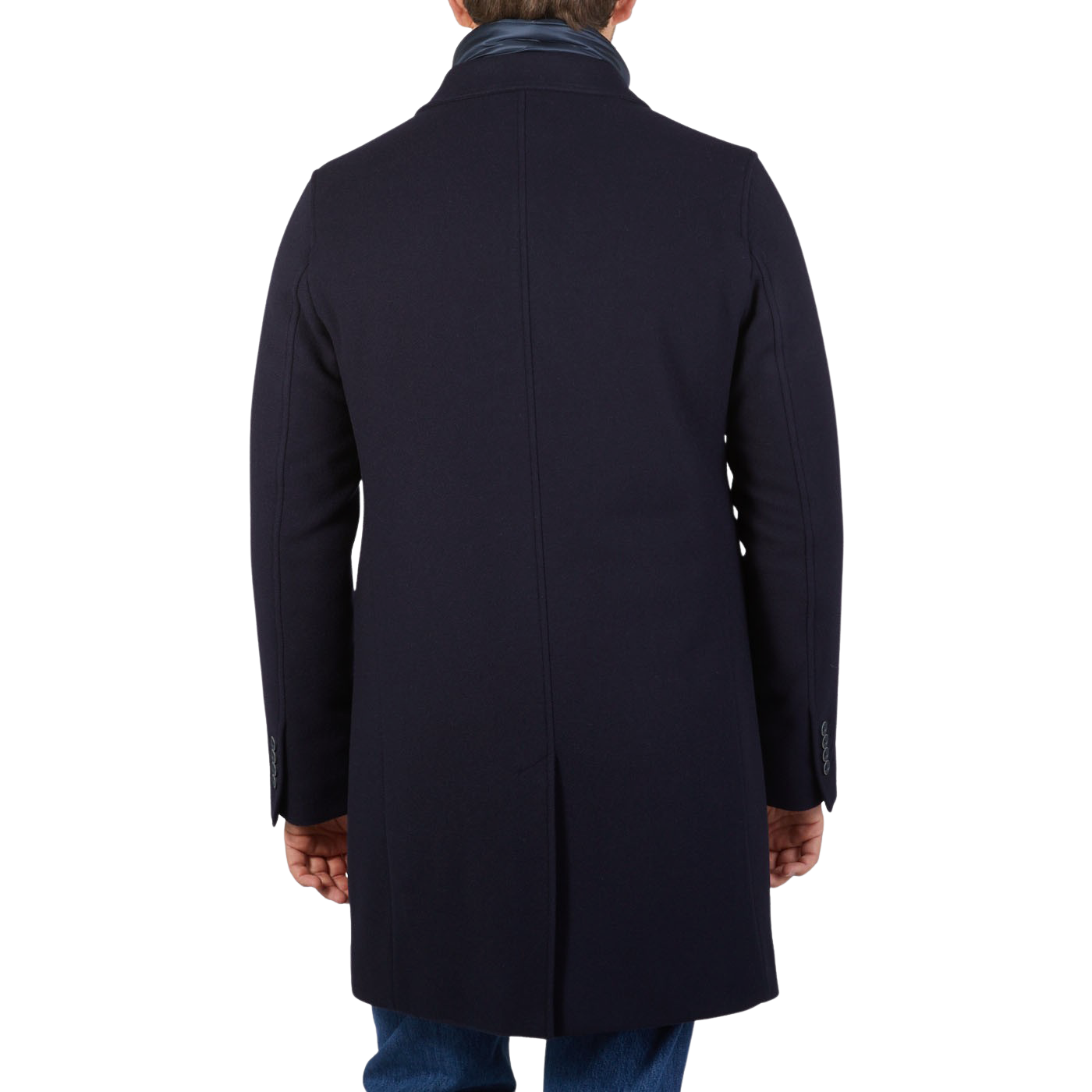 The back view of a man wearing a Herno navy wool down padded coat.
