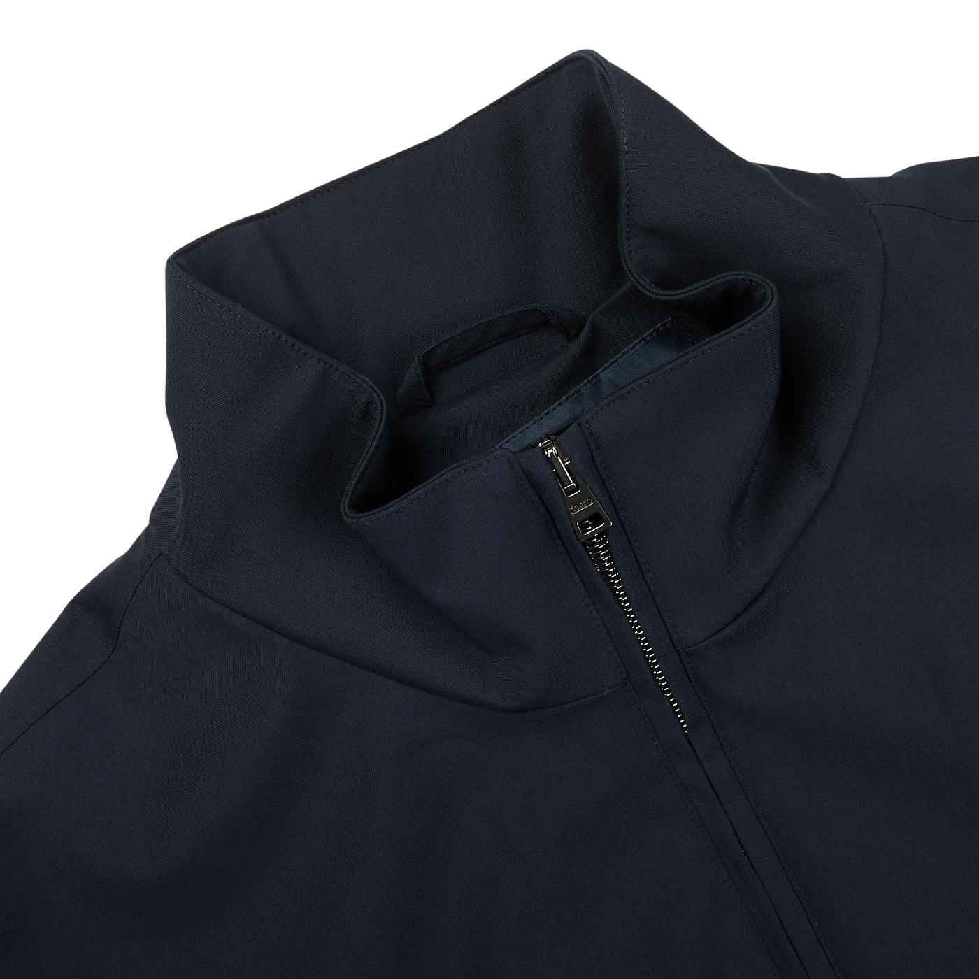 The back of a navy blue Herno Loro Piana Storm System Blouson jacket with a zipper.