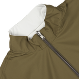 Close-up of a Herno olive green, water-resistant nylon jacket with a white inner lining and a partially unzipped silver zipper.