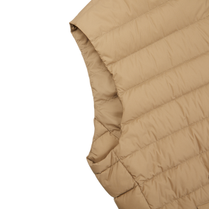 A Sand Beige Nylon Goose Down Quilted Gilet by Herno on a white surface.
